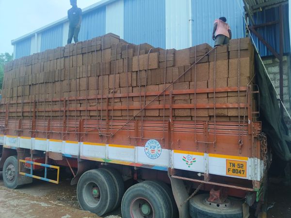 Workers Loading Coco Peat Blocks